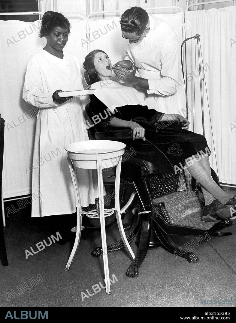New York, New York:  January 19, 1925 The North Harlem Dental Clinic of the NY Tuberculosis Association provides dental care for those who cannot otherwise afford it. Here is a patient being treated.