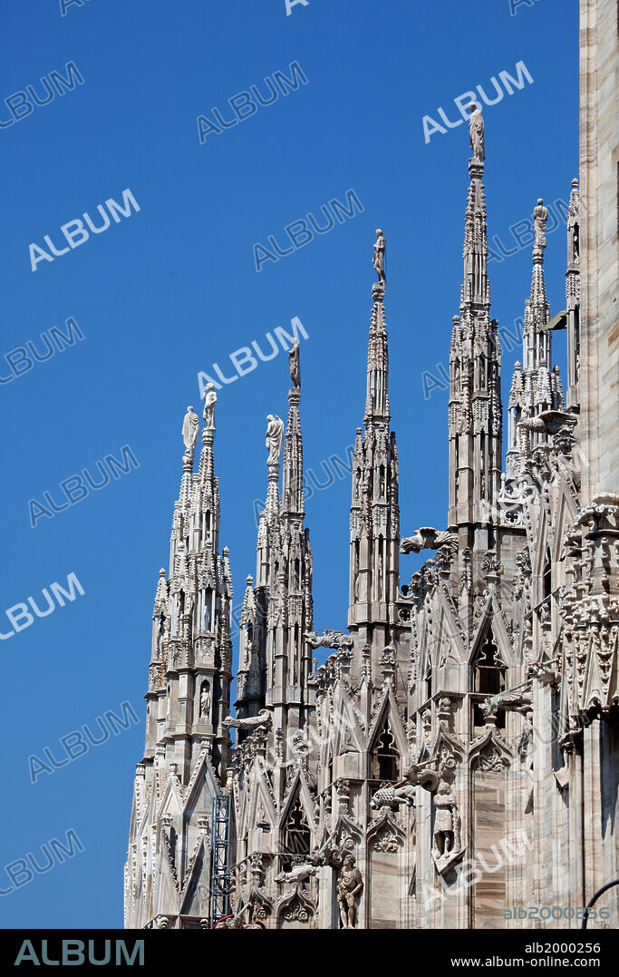 Italy, Milan, Milan Cathedral, Spires, Pinnacles and Statues on Spires. Spires- typical Gothic architectural structures, tapering and freestanding. In the Milan Cathedral more than 135 spires. They are very slender and with elaborate decoration, with statues of all sizes.