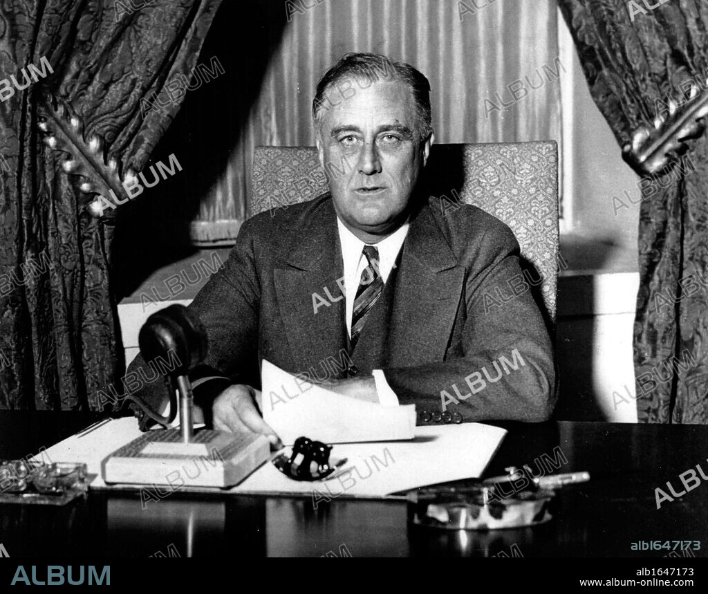Franklin Delano Roosevelt (1882-1945), 32nd President of the United States of America 1933-1945, giving one of his 'fireside' broadcasts to the American nation during.
