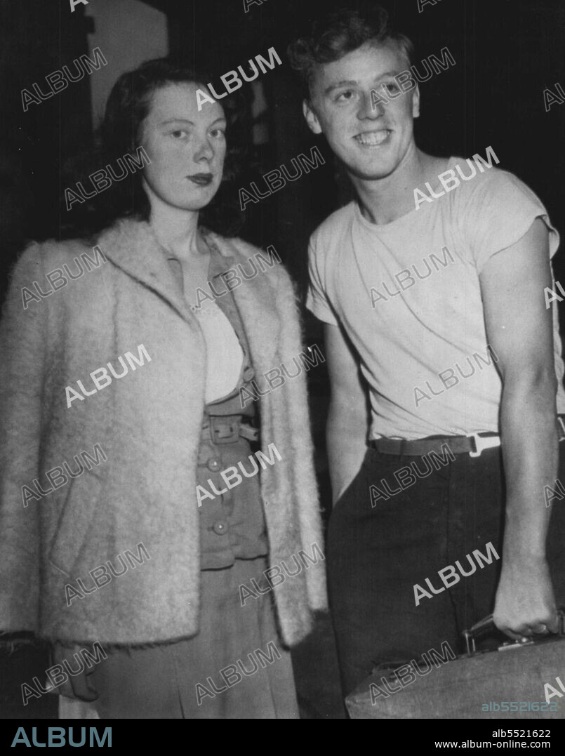 Stowaway Bride And Husband: Donesse Nancy Kuhn, Pretty English Girl, Wife of Discharged G.I., Robert Kuhn of Rochester, N.Y., arrived here today on the S.S. Irvin Macdowell Mrs. Kuhn said she had remained hidden in the bunk of her husband for the first four days. October 10, 1945. (Photo by AP Wirephoto).
