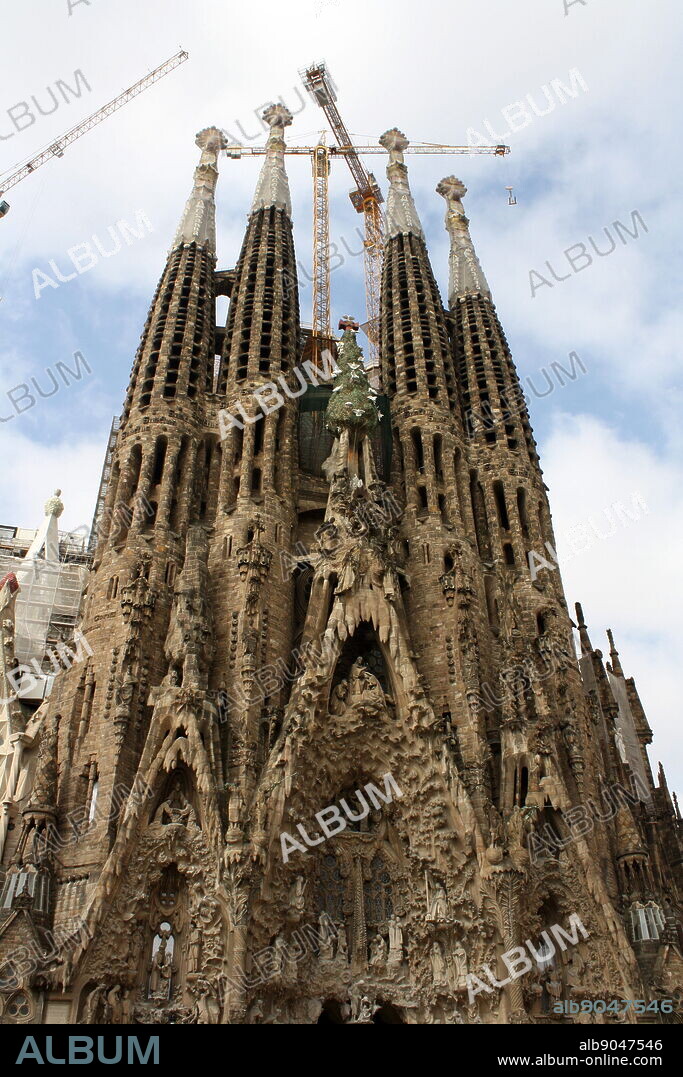 The Basilica I Temple Expiatori de la Sagrada Familia (Sagrada Familia). The very large Roman Catholic church was designed by Catalan architect Antoni Gaudi in a Spanish gothic style architecture as well as incorporating modernism, noucentisme and art nouveau. Although construction began in 1882 it was finally opened November 2010. Barcelona. Spain 2013.