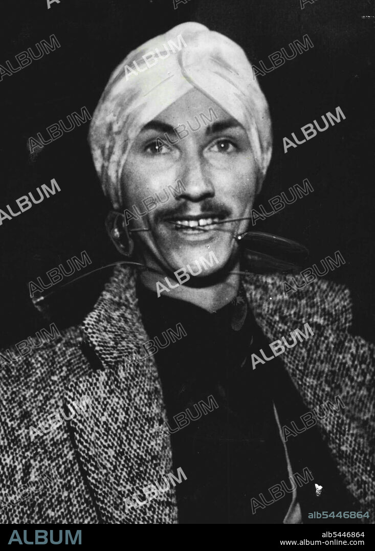 No Fake -- 22-year-old Yvon Yva ***** title of world champion fakir, and when he left Paris recently to attend the world congress of fakirs at Lyons, he boarded the train wearing a few spikes and hat pins nonchalantly thrust through his neck and cheeks. March 19, 1954. (Photo by Paul Popper Ltd.).