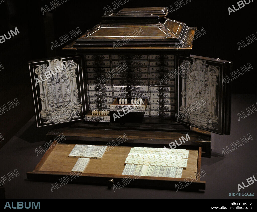 Napier's calculating machines, 17th century (after 1617). In a case with doors and thirty drawers are kept the counters of two abacuses, designed by the Scottish mathematician John Napier (1550-1617). The first abacus consists of sixty numbered rods, called "Napier's bones". It was widely spread in Europe, being used as a portable abacus until the 18th century. The second one, called promptuary, is composed of about three hundred numbered and perforated strips for fast multiplications. Verawood with ivory inlay. National Archaeological Museum. Madrid. Spain.