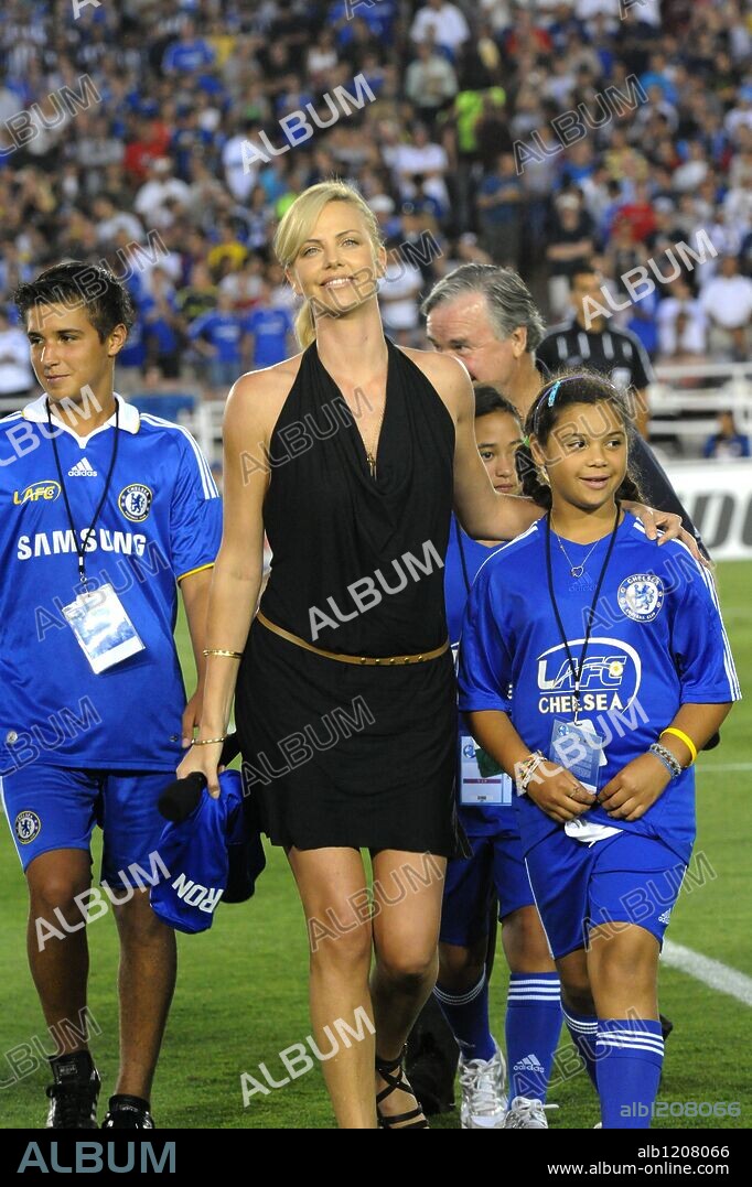 Jul 21, 2009 - Pasadena, California, USA - Actress CHARLIZE THERON, was on hand at the start of the game. The world football challenge landed in the Rose Bowl in Pasadena where Chelsea defeated Inter Milan by a score of 2-0 before a crowd of over 80,000 soccer fans. Chelsea dominated play and controlled the ball throughout the game.  Chelsea scored an early goal in the first half and led 1 to nothing at the half. Chelsea came out aggressive in the second half and scored their second goal on a penalty kick just minutes into the second. They kept pressure on the Inter Milan goal keeper all game and the score would have been greater had it not been for several sensational saves by the Inter Milan keeper. Chelsea's ball control was the key to their victory. The game was the second leg in a six city tour that features Club America, Chelsea FC, Inter Milan, and AC Milan. Game one of the challenge took place on Sunday in Stanford Stadium, Palo Alto, California, where Club America defeated Inter Milan in overtime penalties. The six game challenge will end on July 26 when Club America plays Chelsea FC at Cowboy Stadium, Arlington, Texas. 21/07/2009
