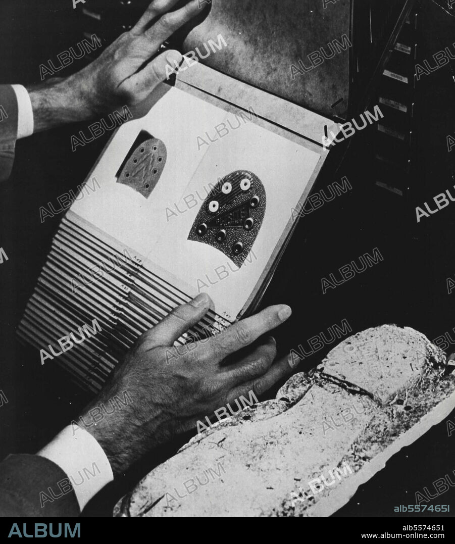 J. Edgar Hoover, Director, F.B.I. -- In addition to fingerprints, the heel mark of a shoe or the tread of an automobile tire may provide a valuable clue to technicians at the F.B.I. technical laboratory in Washington, D.C. September 19, 1950. (Photo by United States Information Service).