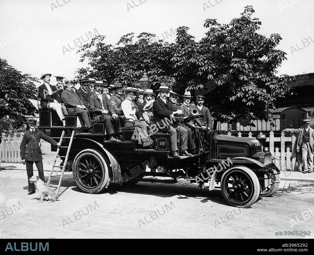 1903 Milnes Daimler Charabanc, (c1903?). Passengers sit in rows aboard the vehicle, having gained access to their seats by climbing a ladder.
