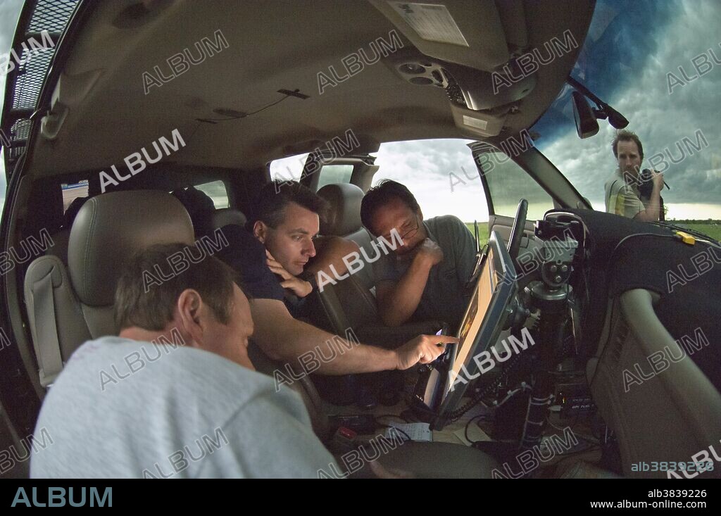 Veteran storm chaser Tim Samaras, second from right, monitors a severe storm from his chase vehicle with longtime chase partner Carl Young (second from left) and Jon Davies (far left) in 2005. Samaras, an esteemed scientist and noted tornado researcher, died with his son Paul and Young while intercepting a violent twister near El Reno, Oklahoma on May 31, 2013. One of the world's best-known storm chasers, Samaras received 18 grants for field work from The National Geographic Society over the years. Samaras and Young were also known from the Discovery Channel show "Storm Chasers," which aired for five years.