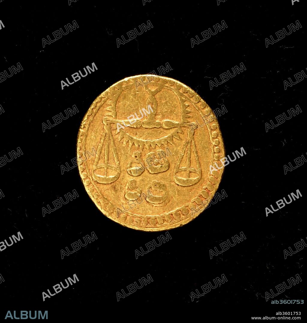 Coin with Sign of Libra. Dimensions: Diam. 7/8 in. (2.2 cm)
D. 1/16 in. (0.2 cm). Date: dated A.H. 1034/ A.D. 1625.
This coin bears a Libra symbol found on the other objects in the collection, but it was not created for talismanic purposes. This sign instead corresponds to the month in which it was minted. In his memoirs, the Mughal emperor Jahangir recorded his inspired idea for the unusual design of this and other coins depicting the signs of the zodiac.