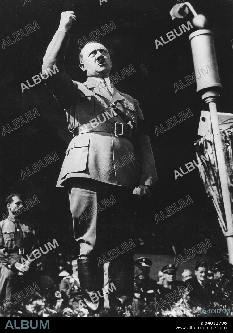 Adolf Hitler addressing a Nazi rally at Nuremberg, Germany, 1930s. The Nazi Party held annual political rallies at Nuremberg from 1927 until 1938. After the Nazis claimed power in 1933 the rallies became massive state propaganda events. Hitler's deputy, Rudolf Hess, is in the bottom left of the picture.