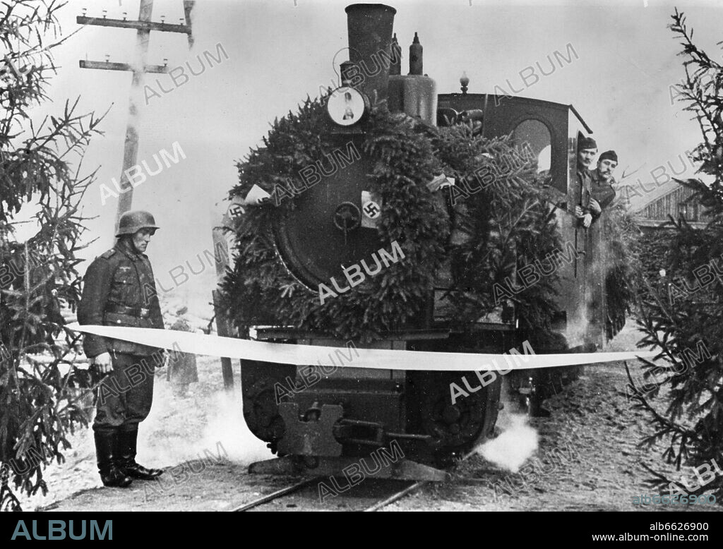 The Nazi Propaganda! on the back of the image reads: "The Feldbahn (narrow gauge railway) on the Eastern Front. The wreathed train rips a white band and opens the train route." Image from the Eastern Front, published 20 November 1942. The attack on the Soviet Union by the German Reich was agreed on in July 1940 and prepared since December 1940 as the "Operation Barbarossa". On 22 June 1941, the invasion of the Soviet Union by the German Wehrmacht started. Photo: Fotoarchiv für Zeitgeschichte/Archiv. 20/11/1942
