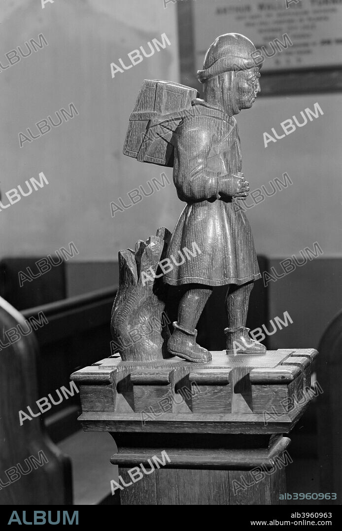 'Pedlar' pew end, Swaffham, Norfolk, 1964. This Victorian pew end in the church of St Peter and St Paul, Swaffham, depicts a pedlar with a pack on his back.