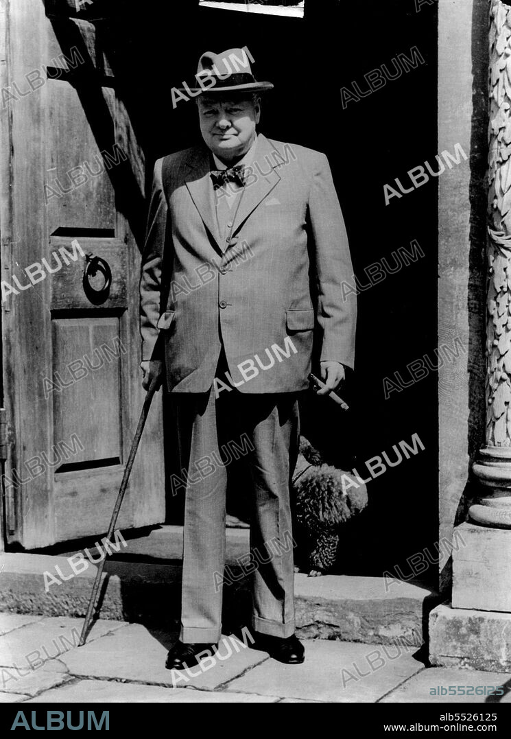 Churchill Looks Fit - Leaves Chartwell For Chequers : Looking very fit, Prime Minister Sir Winston Churchill leaves his home at Chartwell, Kent, for Chequers, the Premier's official country residence. to-day (Friday).This is the first tire Sir Winston has been photographed since doctors ordered him to rest a month ago. Sir Winston in 1953 - think neck and heavy shoulders combined to give him the appearance of a bull of a man. July 24, 1953. (Photo by Reuterphoto).