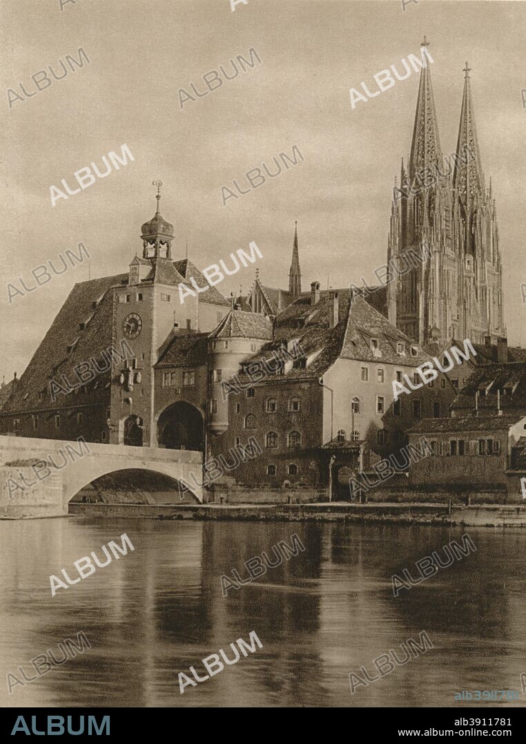 'Regensburg - Bridge-Gate and Cathedral Towers', 1931. From Deutschland by Kurt Hielscher. [F. A. Brockhaus, Leipzig, 1931].