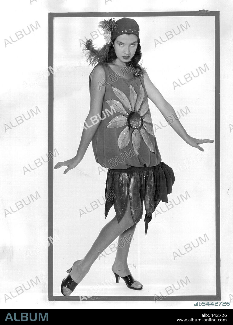 Dancer Peggy Ryan gives her horrified reaction to the new Christian Dior "H" Look. Suitable only for the Charlston, she claims. Peggy arrives in Sydney soon to appear with Johnnie Ray. September 03, 1954. (Photo by L.A. Todd).
