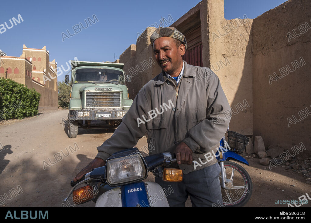 biker and truck, Skoura, Ouarzazate Province, morocco, africa.