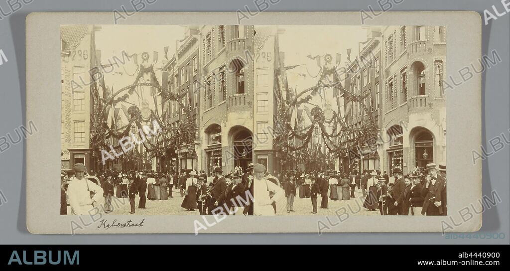 De Kalverstraat, decorated on the occasion of the inauguration of Queen Wilhelmina, Amsterdam, the Netherlands, the Netherlands. Many people on the street., Wilhelmina (Queen of the Netherlands), Cornelis Johannes Lodewicus Vermeulen, anonymous, Kalverstraat, 1898, paper, photographic paper, cardboard, h 75 mm × w 152 mm.
