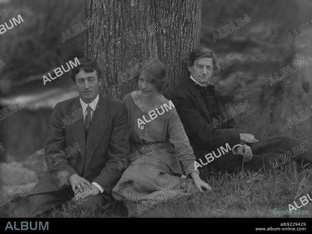 ARNOLD GENTHE. Millay, Edna St. Vincent, Miss, with Bliss Carman and George Sterling, seated against a tree, 1914.