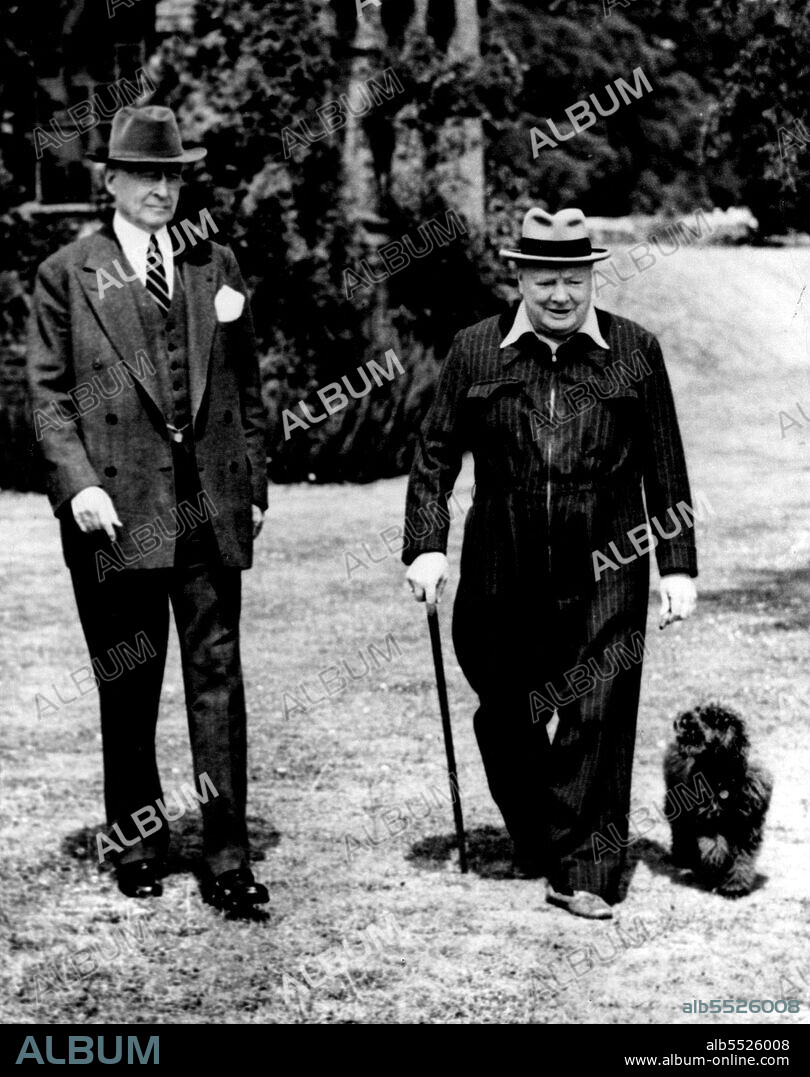 Chiurchill's Mission -- Churchill (D) - Elder Statesman Bernard Baruch, visiting England two drops in on his wartime buddy, Winston Churchill, at the Prime Minister Home in Kent. The British leader coveralls that he made famous. His poodle, Rufus, is always at his side. December 23, 1951. (Photo by International News Photo).