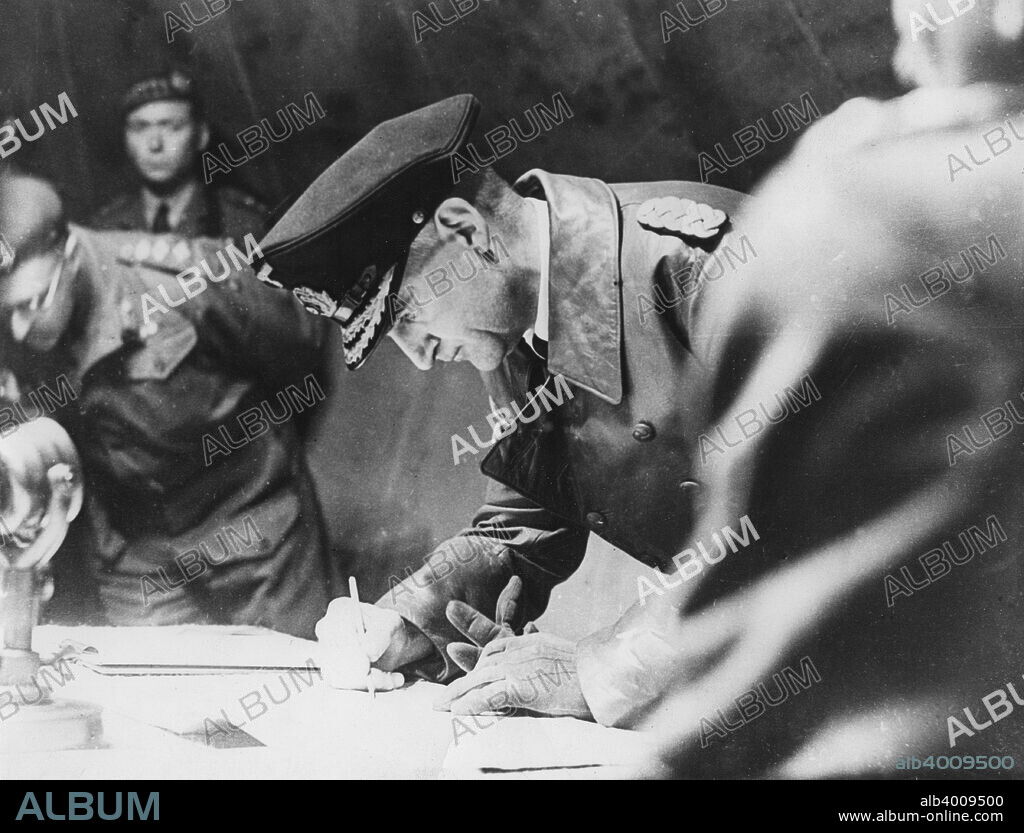 Rear-Admiral Gerhard Wagner signing the German surrender document ending World War II, 1945.