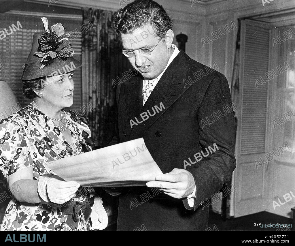 David O Selznick (1902-65), American producer and director, being presented with illuminated copy of resolution passed by Atlanta Ladies' Memorial Association, commending him for making Gone with the Wind conform to the facts of history and the traditional etiquette, customs and manners of the Old South.