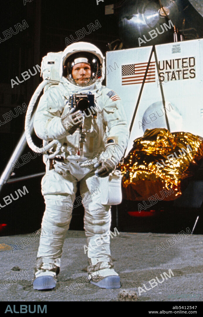 Astronaut Neil Armstrong, wearing an Extravehicular Mobility Unit, participates in a simulation of deploying and using lunar tools on the surface of the moon during a training exercise in Building 9 on April 22, 1969. In the background is a Lunar Module mock-up. Apollo 11 was the spaceflight that landed the first two people on the Moon. Commander Neil Armstrong and lunar module pilot Buzz Aldrin landed the Apollo Lunar Module Eagle on July 20, 1969. Armstrong became the first person to step onto the lunar surface six hours later on July 21; Aldrin joined him 19 minutes later. They spent about two hours together outside the spacecraft, and collected 47.5 pounds of lunar material to bring back to Earth. Command module pilot Michael Collins flew the command module Columbia alone in lunar orbit while they were on the Moon's surface. Armstrong and Aldrin spent 21.5 hours on the lunar surface before rejoining Columbia in lunar orbit.