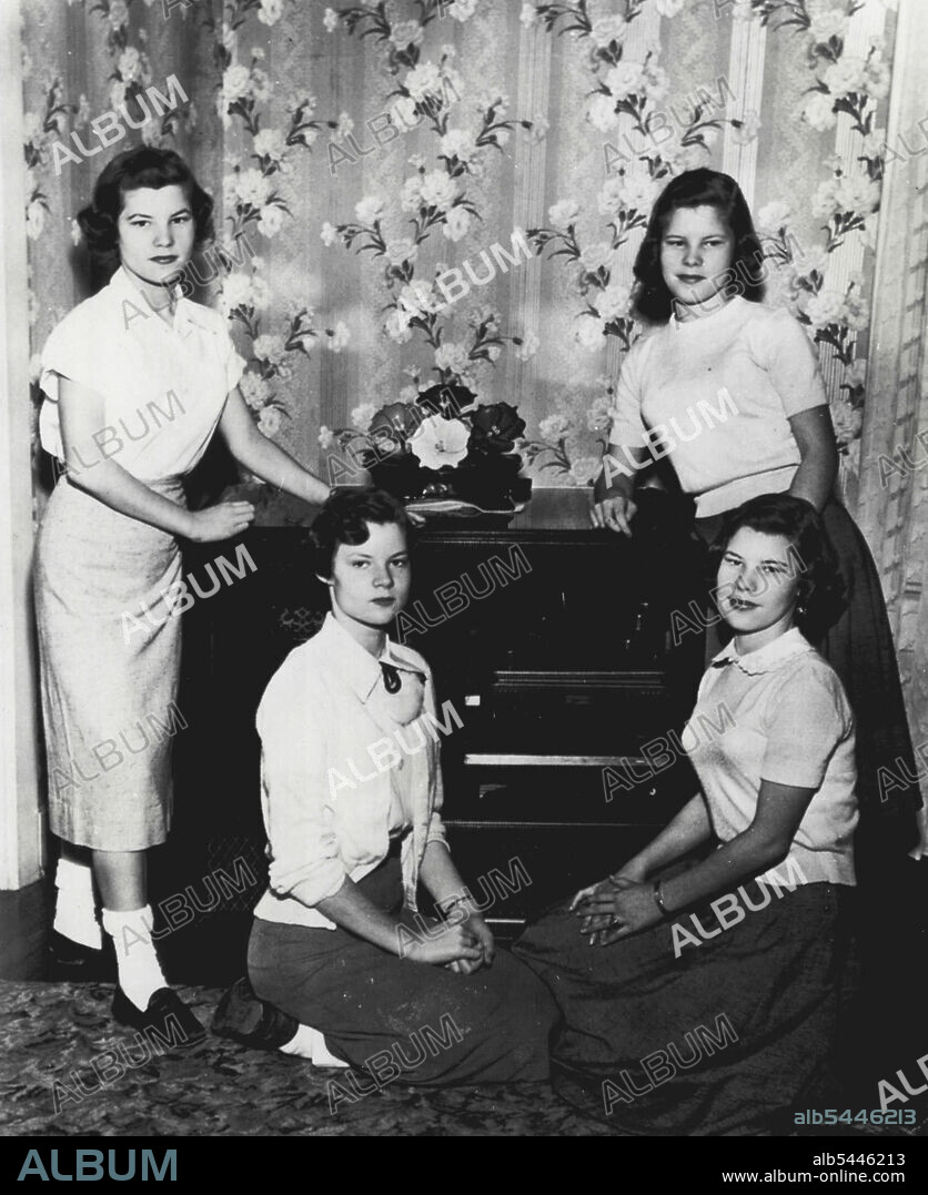 Quads Pose For Birthday Picture -- The Badgett quadruplets are shown above as they posed for their 15th birthday picture here. Thus far the four girls, daughters of Mr. and Mrs. W. Ellis Badgett, have been able to be what they want the most, to be recognized as individuals. They wear different styles of clothes and comb their hair differently. The girls, 15-years-old today, are 9th grade junior high school students. Standing are Jeraldine, left, and Jeanette. Seated are Joan, left, and Joyce. February 1, 1954. (Photo by AP Wirephoto).