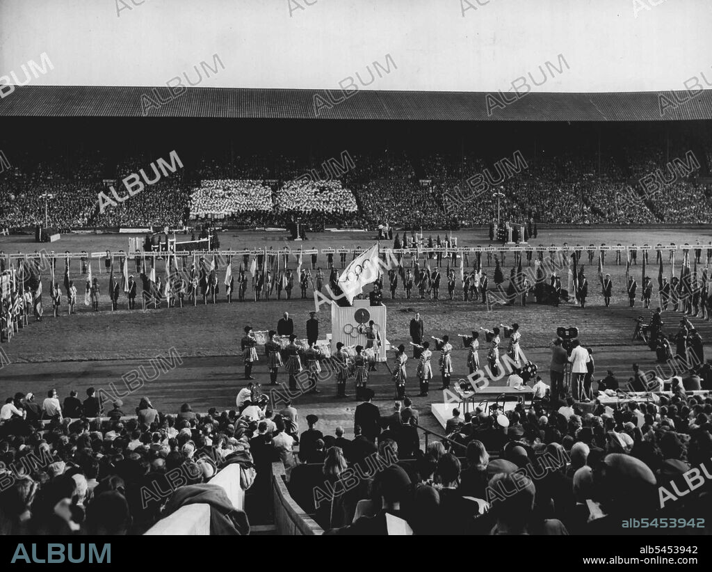 Closing Of The Game Of The XIV Olympiad : A General view of the closing of the games of the XIV Olympiad at Wembley Stadium, London, Aug. 14. At Foreground state trumpeters sound a fanfare. Seen on the tribune of honour is Sir Frederick Wells, Lord Mayor of London. (Obscured by Flag is J. Sigfrid Edstrom, International Olympic Committee President). Standing on right of tribune is Lord Burghley, Chairman of the organising Committee. Behind the tribune are paraded the flags of the competing nations. August 14, 1948. (Photo by Olympic Photo Association).
