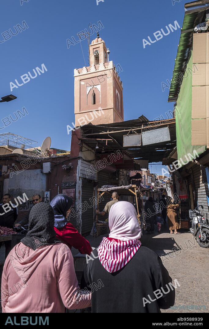 women walking down Derb Dabachi street, marrakesh, morocco, africa.