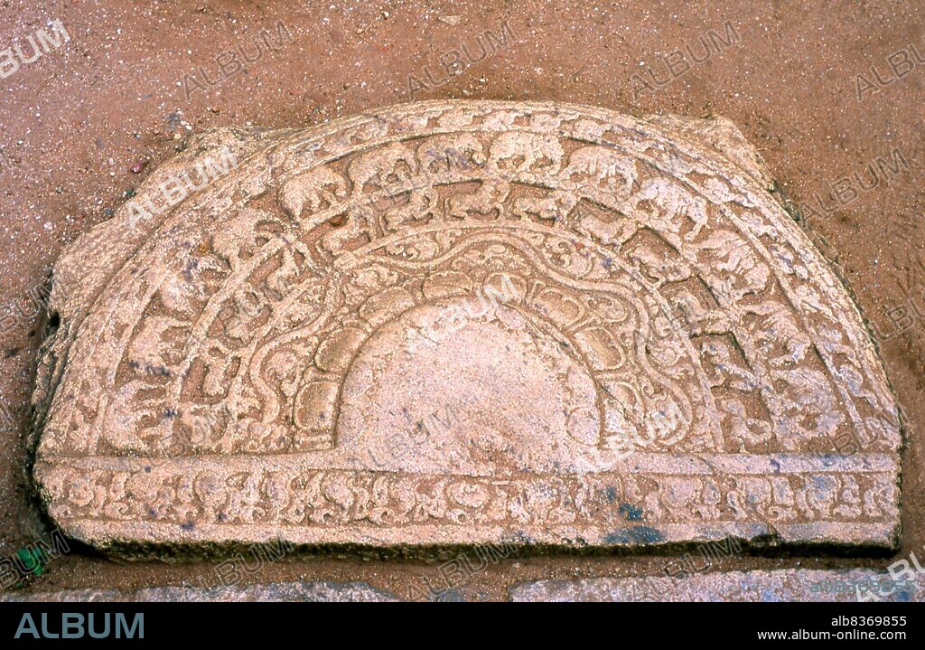 <i>Sandakada pahana</i> is an elaborately carved semi-circular stone slab, usually placed at the bottom of staircases and entrances and is a unique feature of the Sinhalese architecture of ancient Sri Lanka. It symbolises the cycle of Sasra in Buddhism.<br/><br/>. Vatadage is a type of Buddhist structure found in Sri Lanka. It is also known as a dage, thupagara, and cetiyagara. Vatadages were built around small stupas for their protection, which often enshrined a relic or were built on hallowed ground.<br/><br/>. Polonnaruwa, the second most ancient of Sri Lanka's kingdoms, was first declared the capital city by King Vijayabahu I, who defeated the Chola invaders in 1070 CE to reunite the country under a national leader.