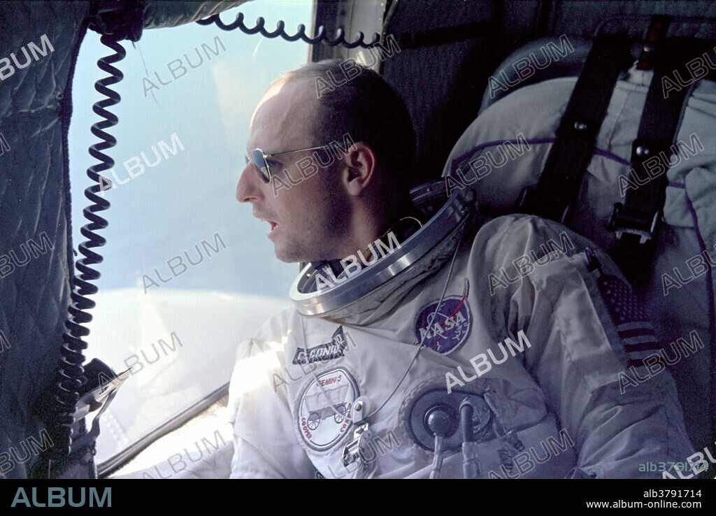 Astronaut Charles "Pete" Conrad Jr. looks out of the helicopter window after recovery from his spacecraft after the Gemini 5 splashdown.