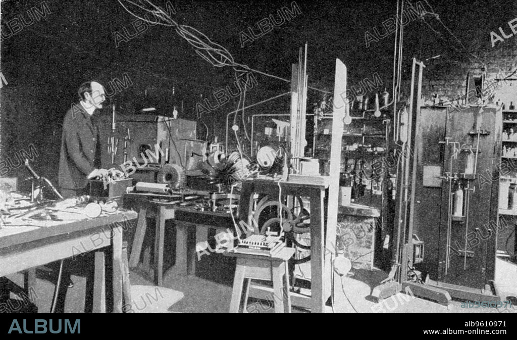 JJ Thomson, British physicist, at work in the Cavendish Laboratory, Cambridge. Joseph John Thomson (1856-1940)  discovered the electron and was a pioneer of nuclear physics. In 1896 at Cambridge he began experiments on cathode rays, demonstrating that they were in fact particles with a negative charge and were much smaller than an atom. These particles were later renamed electrons. He was awarded the Nobel Prize for Physics in 1906 and was knighted in 1908.