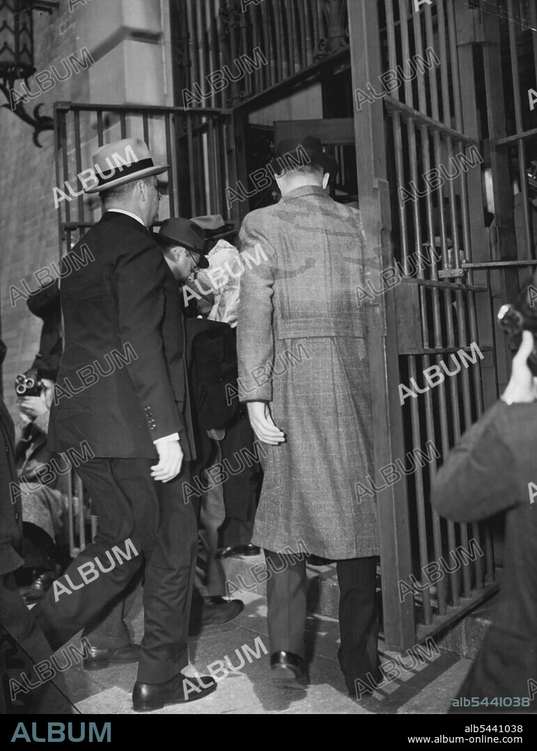 Sing Sing's Doors Open For Whitney -- The barred gates of Sing Sing prison swung open today for Richard Whitney, once broker for the House of Morgan. His bulky frame sagging Whitney walked in to serve from to 10 years for grand larceny. December 4, 1938. (Photo by Associated Press Photo).