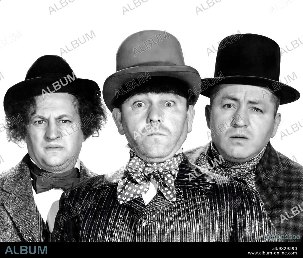 CURLY HOWARD, LARRY FINE, MOE HOWARD and THE THREE STOOGES in UNCIVIL WAR BIRDS, 1946, directed by JULES WHITE. Copyright COLUMBIA PICTURES.