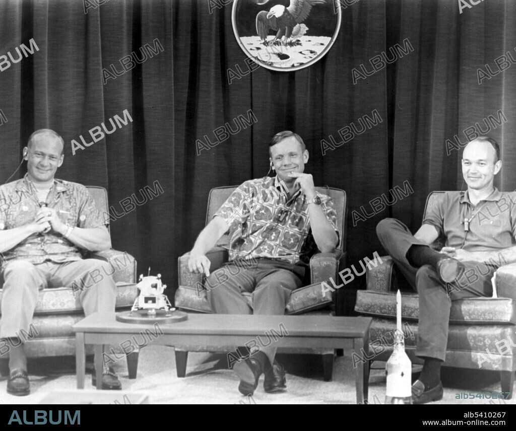 Apollo 11 crew members (R-L) Michael Collins, Neil Armstrong, and Edwin Aldrin, participated in a closed circuit press conference the night before they began their historic lunar landing mission. The press conference with questions via intercom, was held under semi-isolation conditions to avoid exposing the astronauts to possible illness at the last minute. Apollo 11 was the spaceflight that landed the first two people on the Moon. Commander Neil Armstrong and lunar module pilot Buzz Aldrin landed the Apollo Lunar Module Eagle on July 20, 1969. Armstrong became the first person to step onto the lunar surface six hours later on July 21; Aldrin joined him 19 minutes later. They spent about two hours together outside the spacecraft, and collected 47.5 pounds of lunar material to bring back to Earth. Command module pilot Michael Collins flew the command module Columbia alone in lunar orbit while they were on the Moon's surface. Armstrong and Aldrin spent 21.5 hours on the lunar surface before rejoining Columbia in lunar orbit.