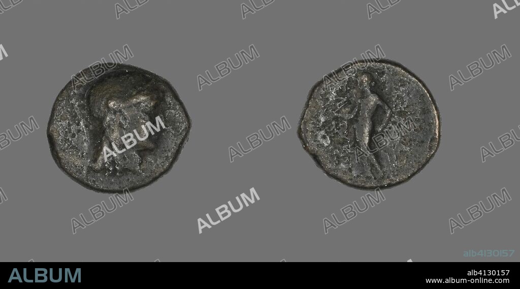 ANCIENT GREEK. Coin Depicting the Goddess Athena. Greek. Date: 246 BC-225 BC. Dimensions: Diam. 1.7 cm; 4.39 g. Bronze. Origin: Greece.