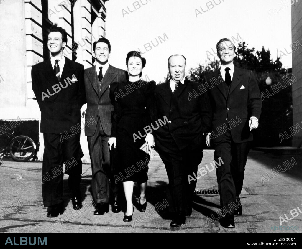 ALFRED HITCHCOCK, FARLEY GRANGER, JOAN CHANDLER and JOHN DALL in ROPE, 1948, directed by ALFRED HITCHCOCK. Copyright Warner Bros./Transatlantic Pictures.