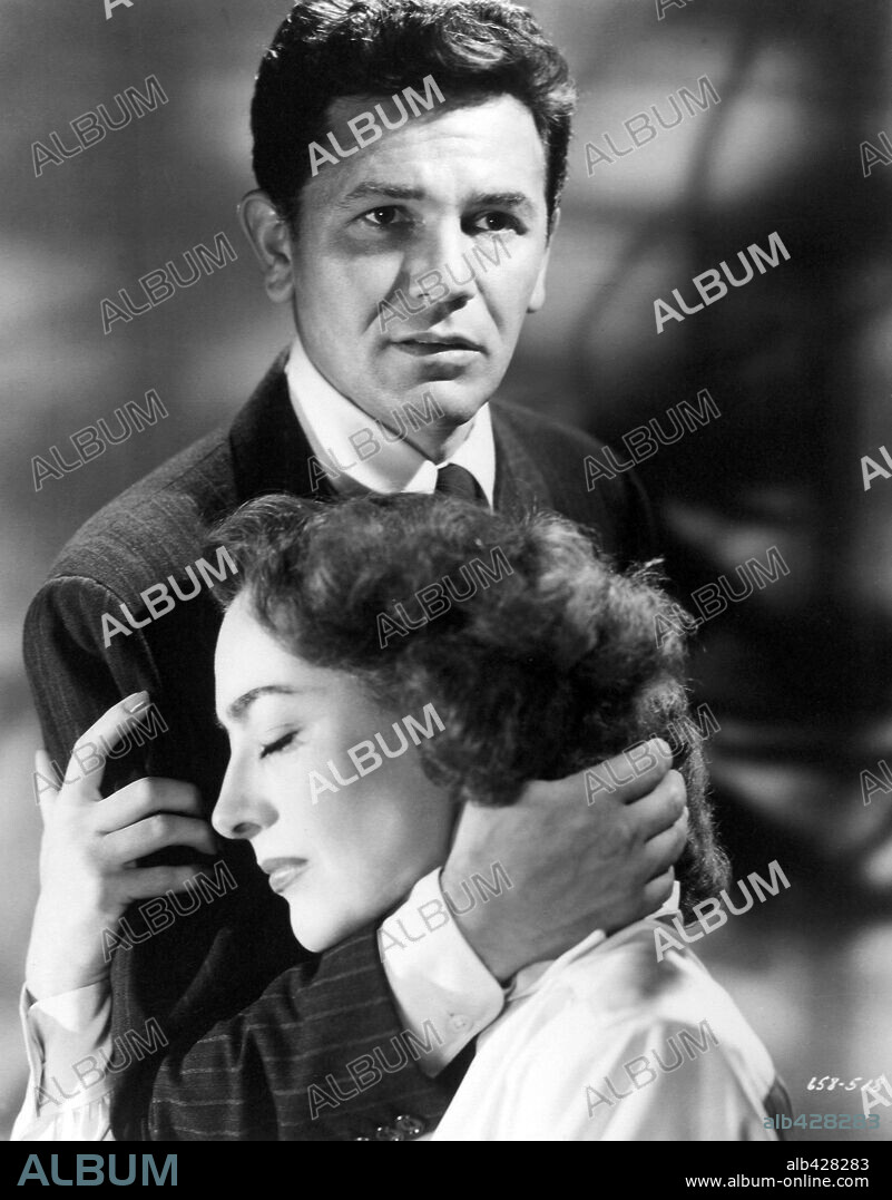 JOAN CRAWFORD and JOHN GARFIELD in HUMORESQUE, 1946, directed by JEAN NEGULESCO. Copyright WARNER BROTHERS.