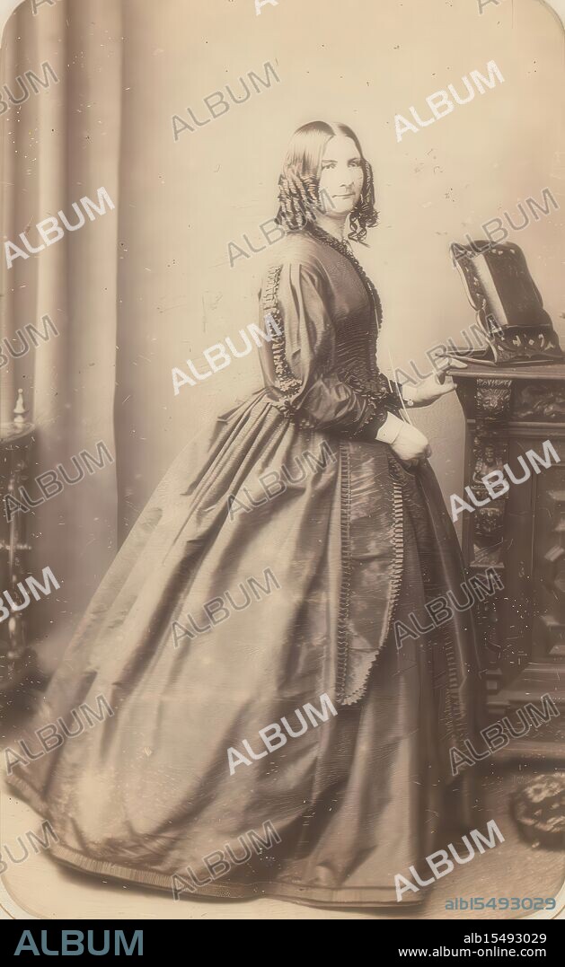Lavis, Rebecca, George, G. and R., Portrait of a standing woman, verso - printed, This photo is part of an album., photograph, foto, carte-de-visite, album page, photos, G & R Lavis, Photographers &, Miniature Painters, 135, Regent St, W, and at 42, Terminus Place, Eastbourne, height 105 mm, width 63 mm, photographer, 1855 - 1890, photographic paper, photo paper, cardboard, albumen print, English, 1831 - 1875, 1827.
