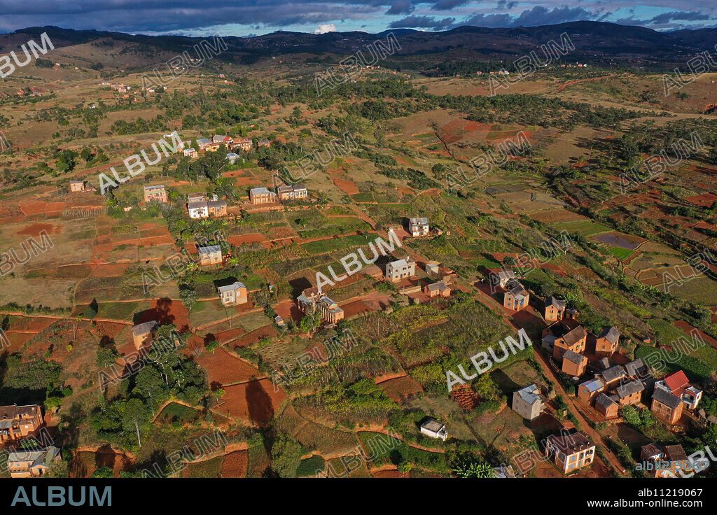 Rice fields and small mud villages near Sandrandahy, on the National Route RN7 between Ranomafana and Antsirabe, Madagascar, Africa.