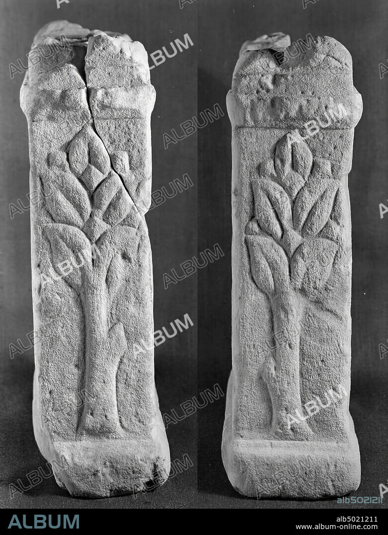 Altar with niche. Sandstone. At the front the left upper part of the alcove was broken off during fishing, it has been partly restored. Nehalennia sitting on a seat with high handrail. With the left hand she holds a bowl of fruit on the lap. She has an object in the right hand (a cup?). On her right side is a dog, lnks of her is a basket of fruit. The shoulder jacket is scalloped. There is a tree on both sides. The back is undecorated. On the mensa you can see a fruit on the right of the middle at the front., Altar, stone, sandstone, 59.5 x 36 x 15 cm, roman 150-250, the Netherlands, Zeeland, Noord-Beveland, Colijnsplaat, Oosterschelde.