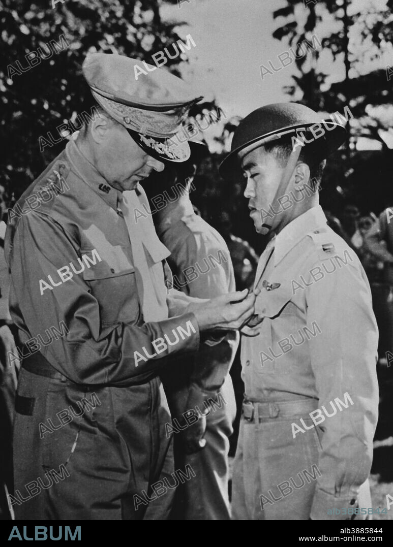 December 22, 1941 - General Douglas MacArthur (left) is shown pinning a Distinguished Service Cross on Captain Jesus A. Villamor, of the Philippine Air Force, for heroism in the air, Manila, Philippines.