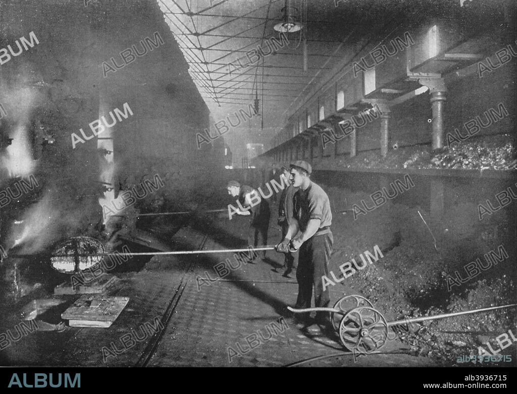 Drawing retorts by hand, South Metropolitan Gasworks, Peckham, London, 1903 (1903). The South Metropolitan Gas Company was founded in 1829. From Living London, Vol. II, by George R. Sims. [Cassell and Company, Limited, London, Paris, New York & Melbourne, 1903].
