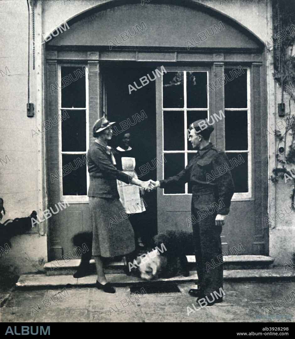 'Goodbye, footman; Good luck, soldier', 1941. A young man leaves his place of employ to begin his life in the army. From Air of Glory, by Cecil Beaton. [His Majesty's Stationery Office, London, 1941].