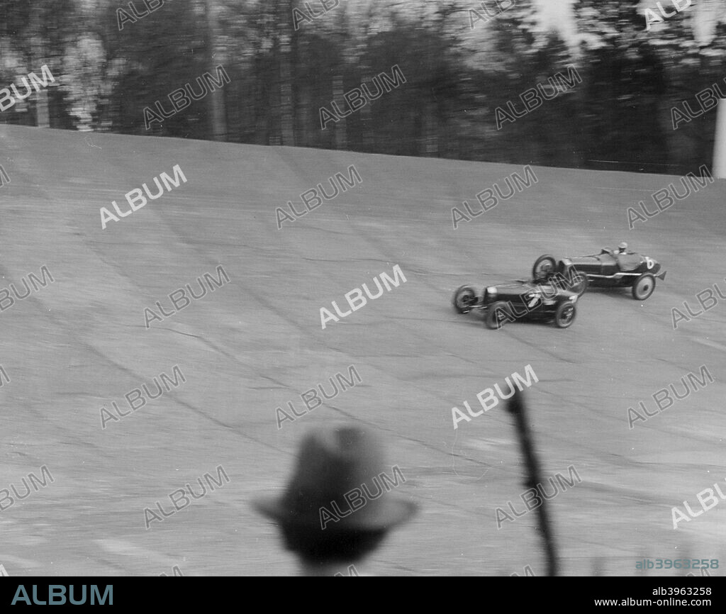 Bugatti  Type 35 1990 cc. Entry No: 6. Driver: Thomas, E.M.  Car colour is Black, with a yellow chassis. Left: Ballot 2976 cc.  Event Entry No: 7. Driver: Dunfee, J. Car colour is Green, with yell. Brooklands.  B.A.R.C. Date: 21.4.30.