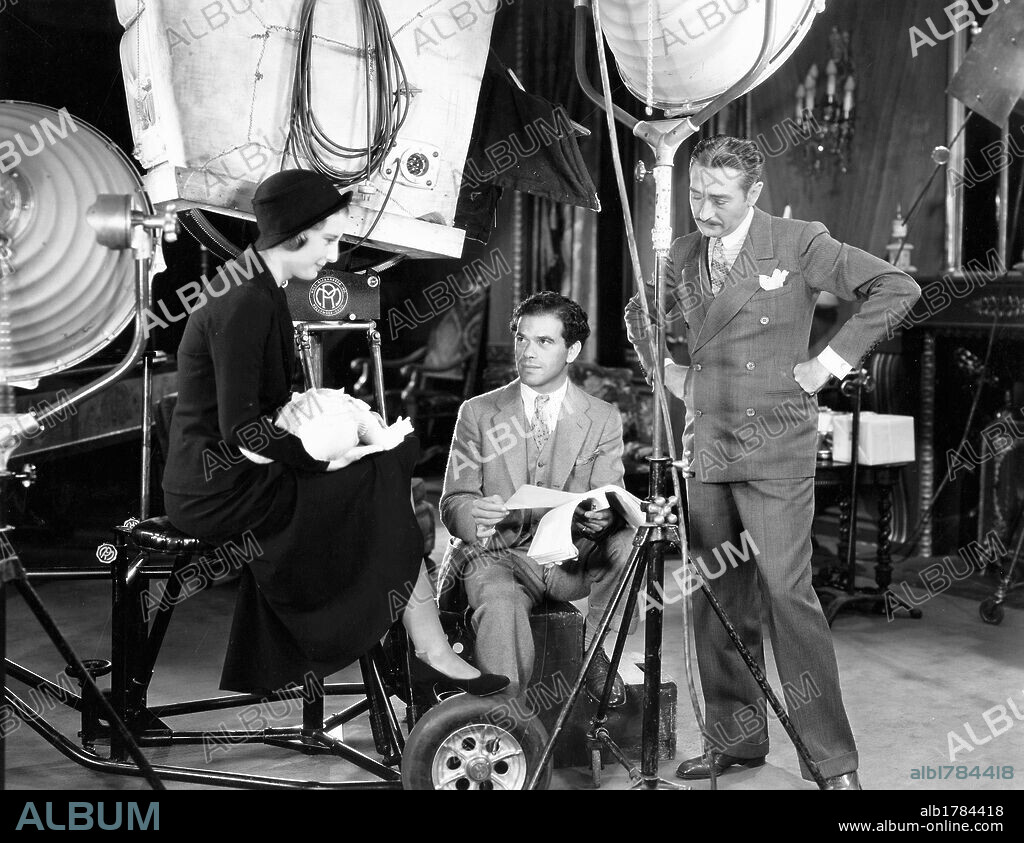 ADOLPHE MENJOU, BARBARA STANWYCK and FRANK CAPRA in FORBIDDEN, 1932, directed by FRANK CAPRA. Copyright COLUMBIA PICTURES.