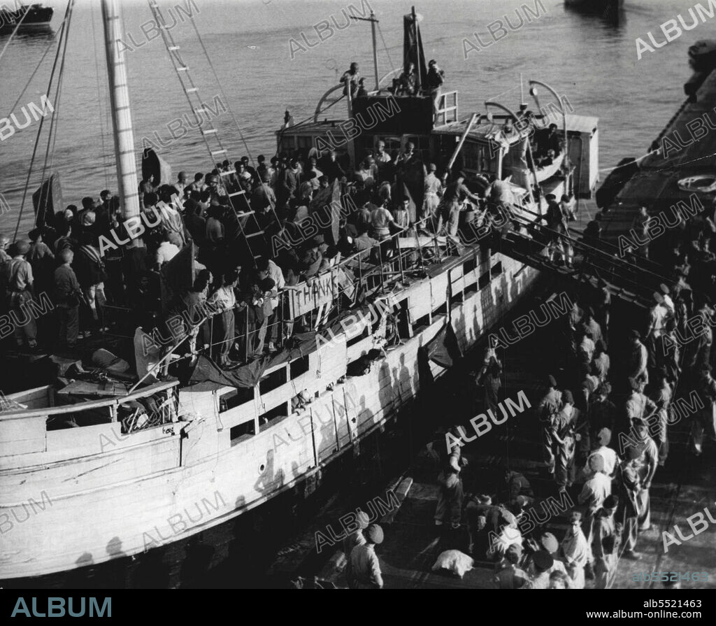Refugee Ship Arrives At Haifa! British Soldiers Meet Opposition During Trans-Shipment -- Jewish refugees being disembarked from "Louisiana" at Haifa, July 28. Scuffling is seen taking plane on the gangplank during the trans-shipment.British soldiers met with some opposition during trans-shipment when the refugee ship "Louisiana", renamed "Shivatzion" carrying illegal immigrants arrived at Haifa, July 20. Some three hundred and seventy four people, including 179 men 71 women and 122 children along with two stretcher cases were trans-shiped from the vessel to the empire shelter. July 29, 1947. (Photo by Associated Press Photo).