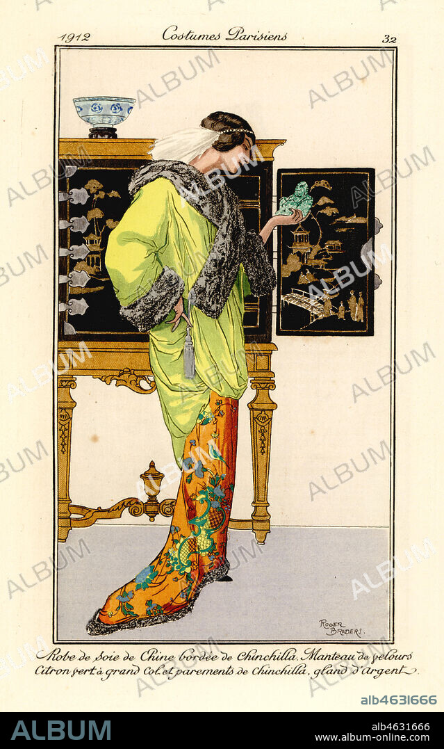 Woman in silk dress with chinchilla trim, lemon-green velvet cape with chinchilla collar and cuffs, holding a jade buddha. Chinese cabinet in the background. Robe de soie de chine bordee de chinchilla, manteau de velours citron vert a grand col et parements de chinchilla, gland dargent. Handcoloured pochoir (stencil) etching after an illustration by Roger Broders from Tommaso Antonginis Journal des Dames et des Modes, Aux Bureaux du Journal des Dames, Paris, 1912.