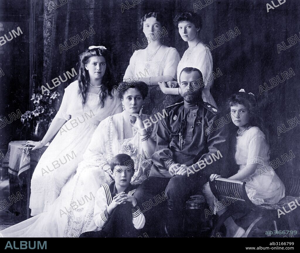Photograph of the Romanov Family (left to right) Marie, Queen Alexandra, Czar Nicholas II, Anastasia, Alexei (front), and standing (left to right), Olga and Tatiana. Dated 1914.
