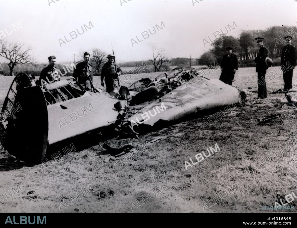 The wreckage of Rudolf Hess's Messerschmidt Bf 110 aircraft, near Eaglesham, Renfrewshire, Scotland, World War II, May 1941. Hess (1894-1987) was appointed Adolf Hitler's deputy shortly after the Nazis came to power in 1933. In 1941, just before the German invasion of the Soviet Union, he flew to Scotland, ostensibly to begin peace negotiations with the British government, but was arrested and spent the rest of the war as a POW. Found guilty of war crimes at the Nuremberg Trials in 1946, Hess spent the rest of his life in Spandau Prison in Berlin.