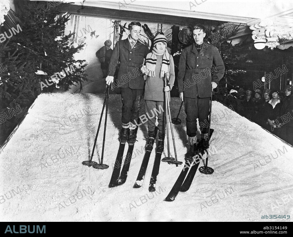 London, England:  December 23, 1926 Harrods department store has introduced an artificial snow into their sporting goods section to enable winter sports enthusiasts to actually try out the equipment. Here a former instructor to the Swiss Army Ski Corps gives a lesson to a customer.